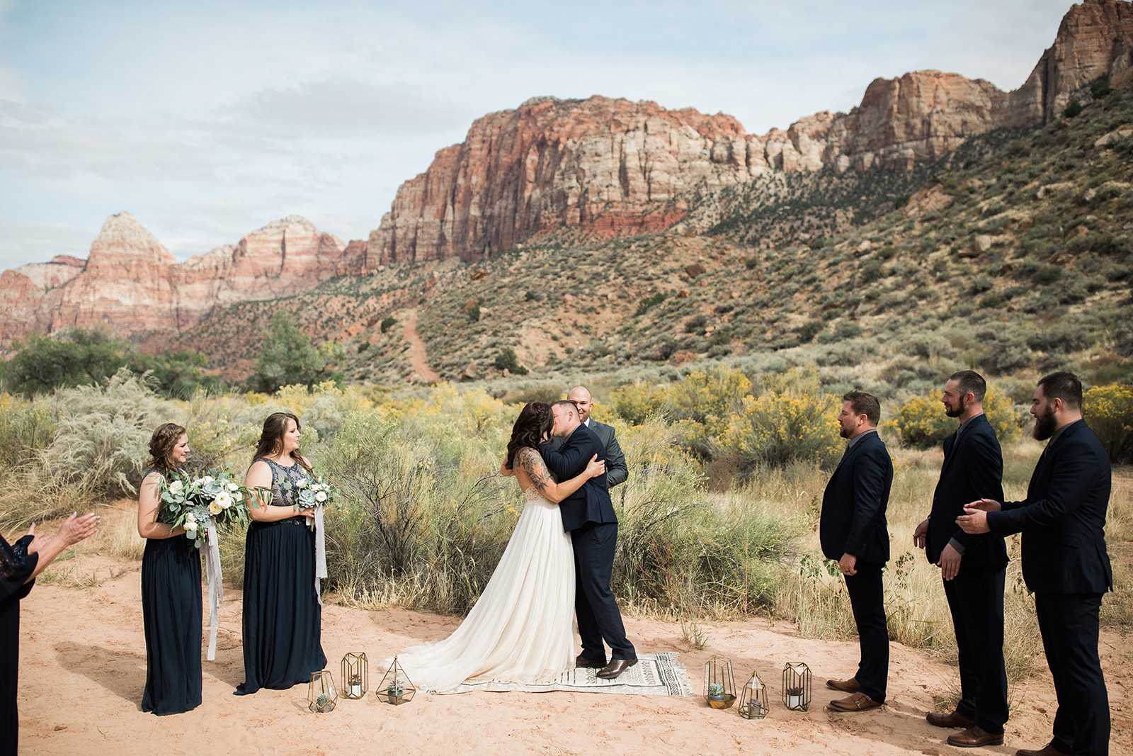 first kiss in front of dramatic Zion mountains
