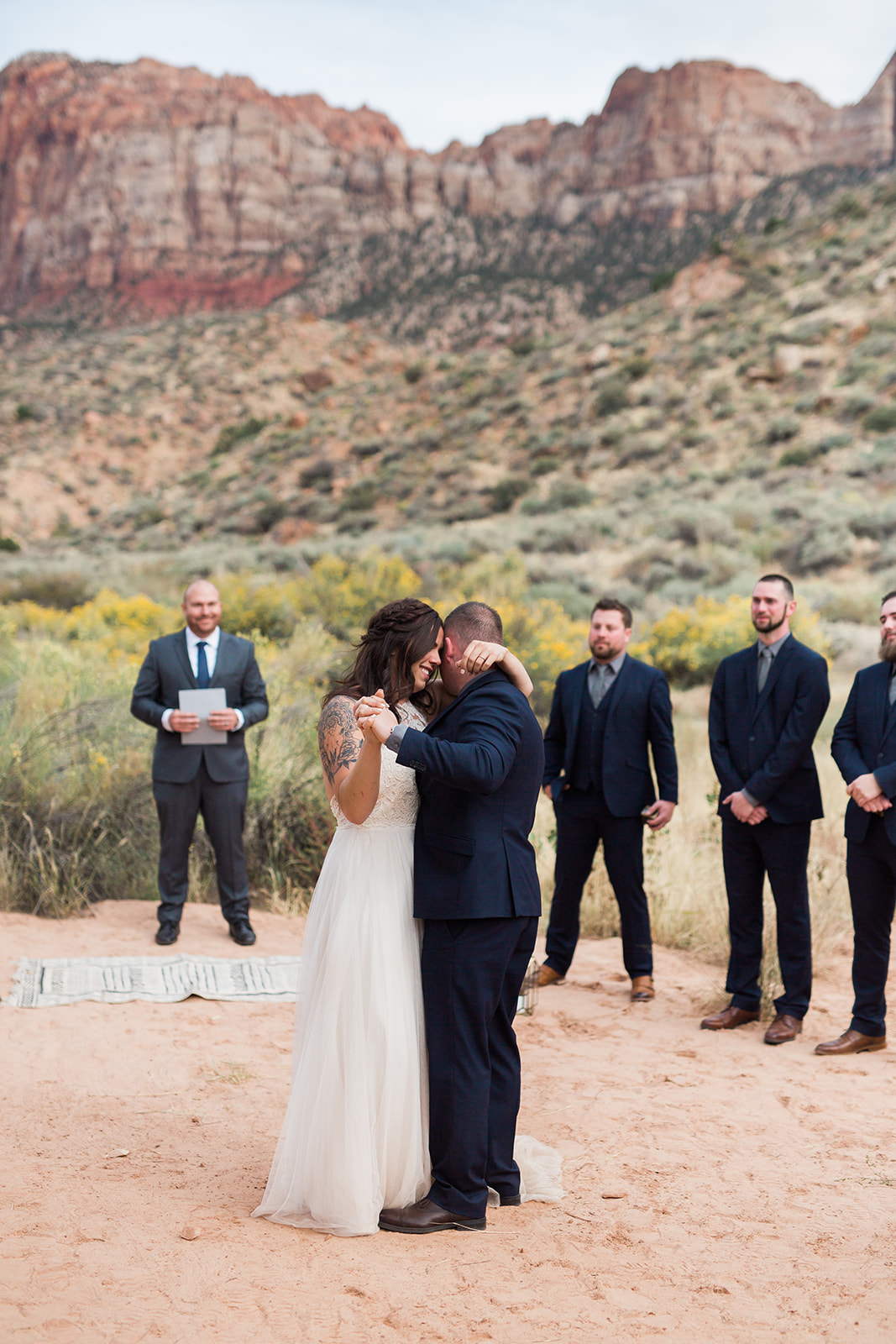 first dance in front of dramatic Zion mountains