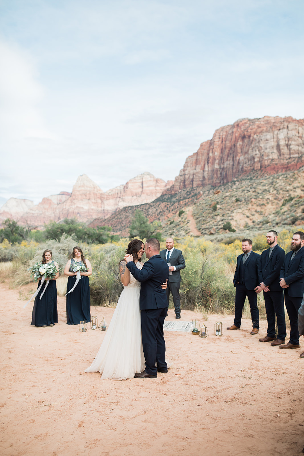 first kiss in front of dramatic Zion mountains