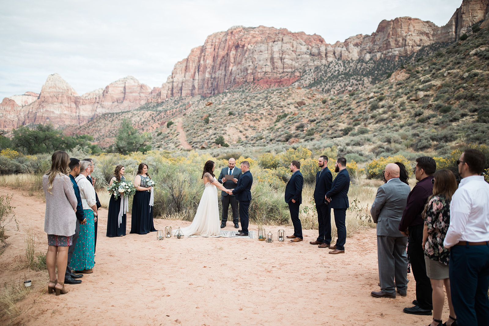 bride and groom join hands for elopement ceremony in Zion
