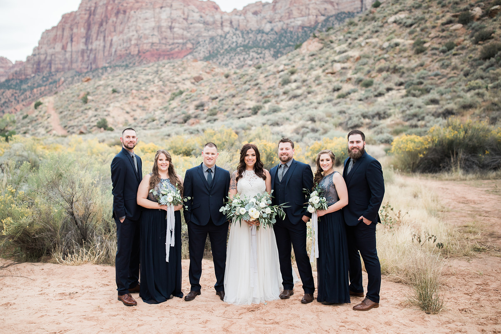 bridal party poses in Zion National Park before elopement