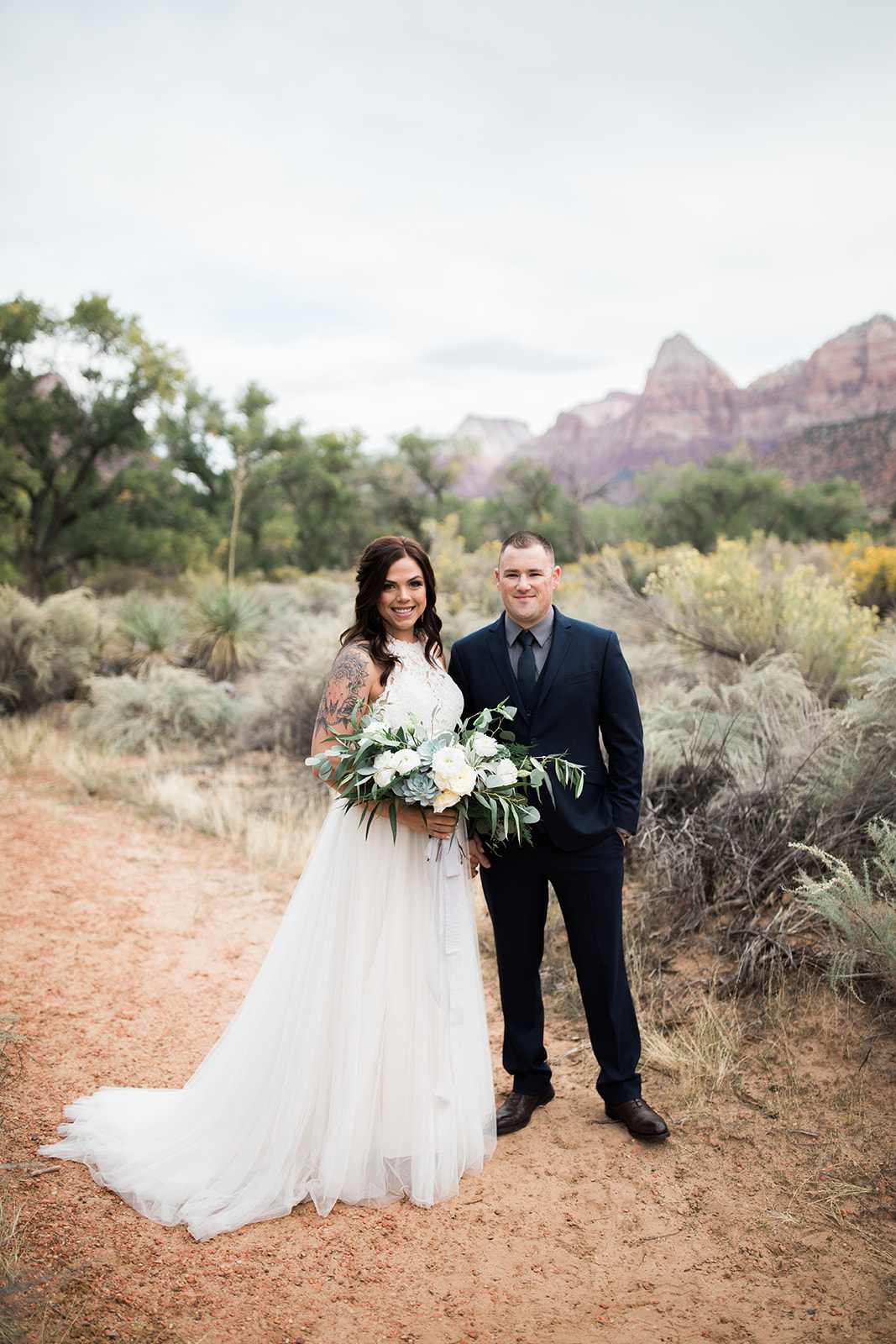 bride and groom portrait in Zion National Park with mountain views