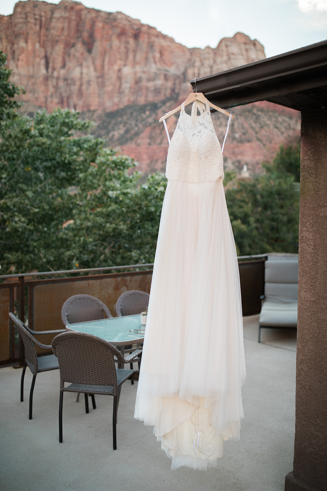 wedding dress in front of red rocks in Zion