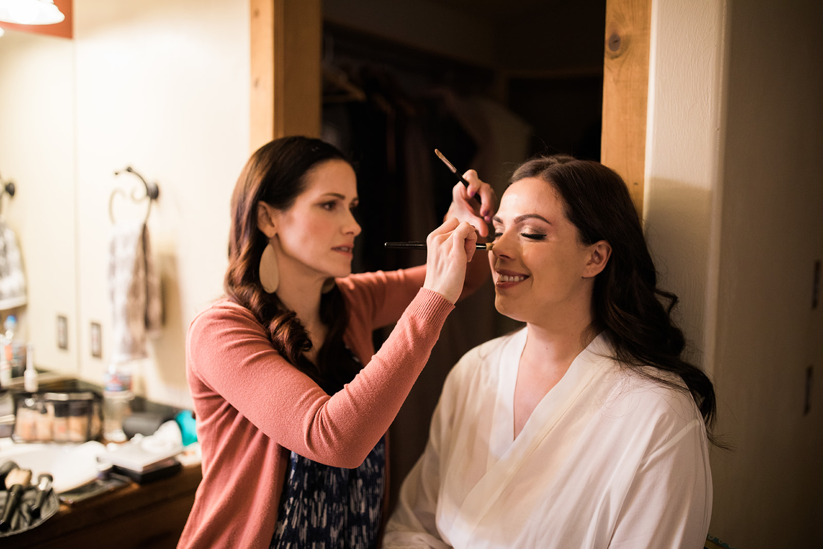bride getting makeup done for elopement