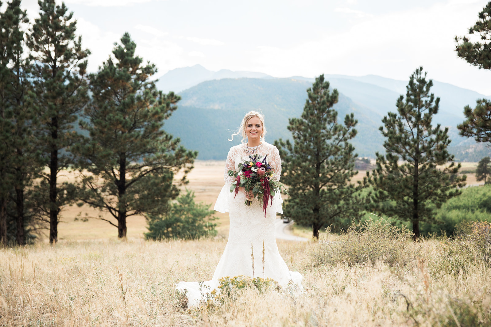 gorgeous bride against stunning colorado rocky mountain national park backgrop