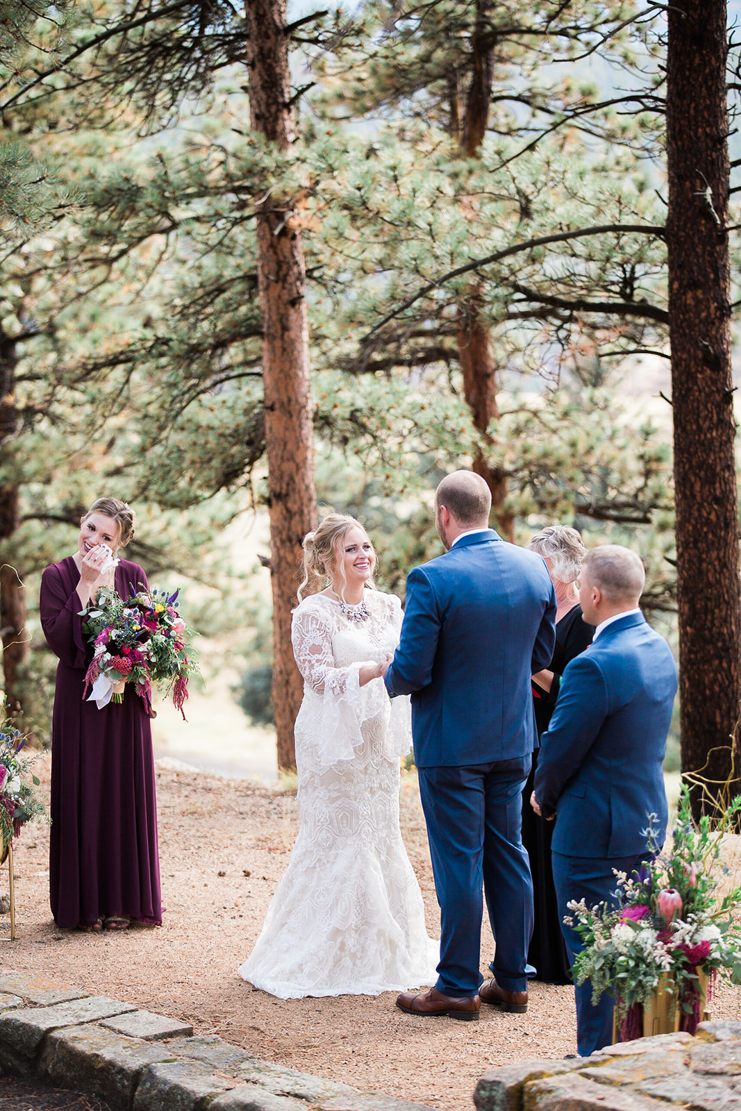 bride and groom getting married while maid of honor cries, outdoor colorado elopement