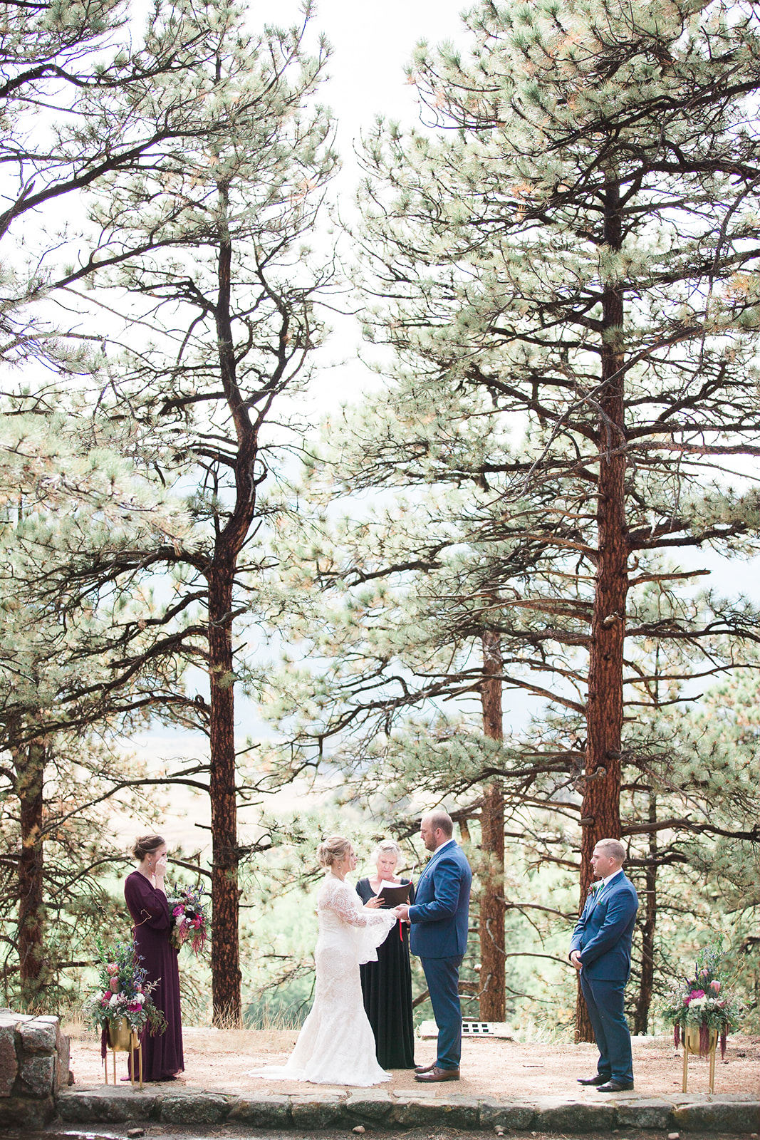 bride and groom married under pine trees at rocky mountain national park elopement