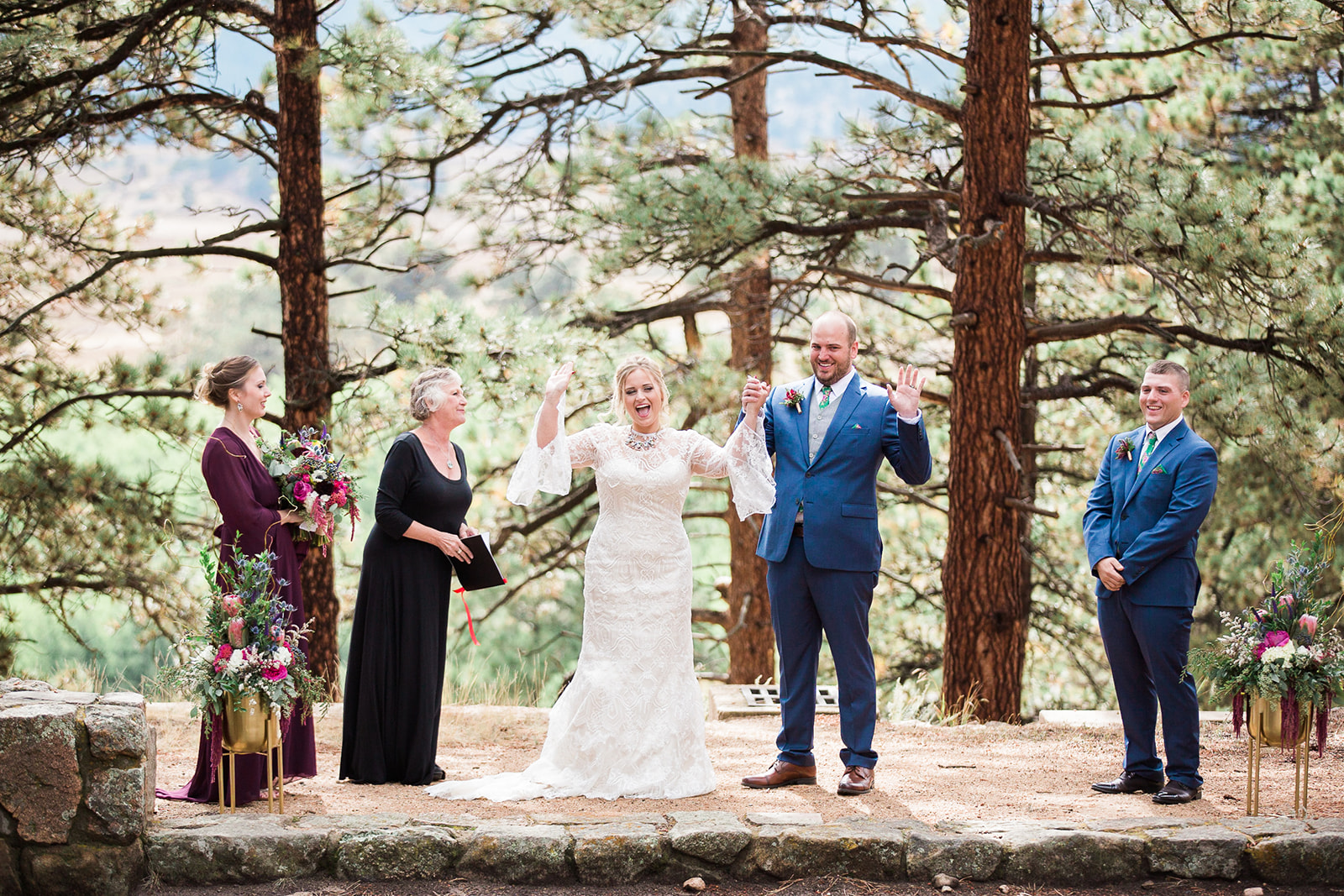 bride and groom celebrate after being married in rocky mountain colorado outdoor elopement
