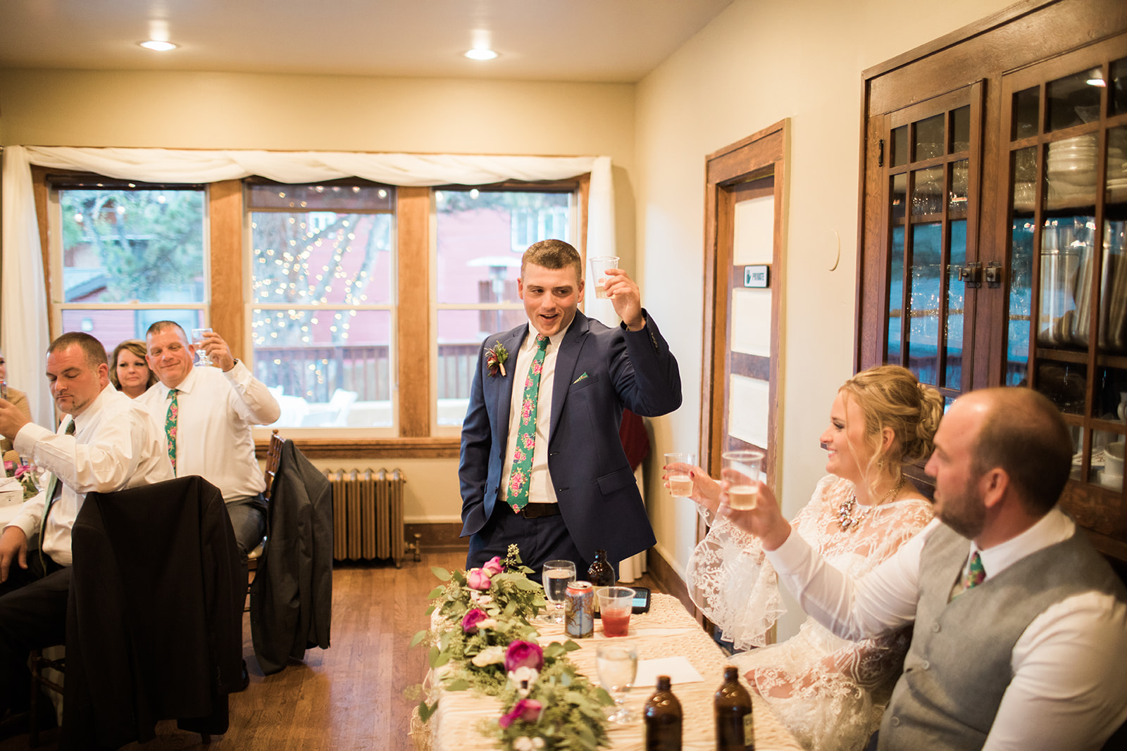 guest giving toast at wedding reception in rocky mountain colorado elopement