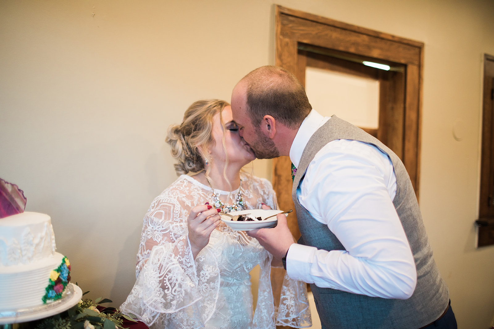 bride and groom cutting cake for colorado mountain elopement reception