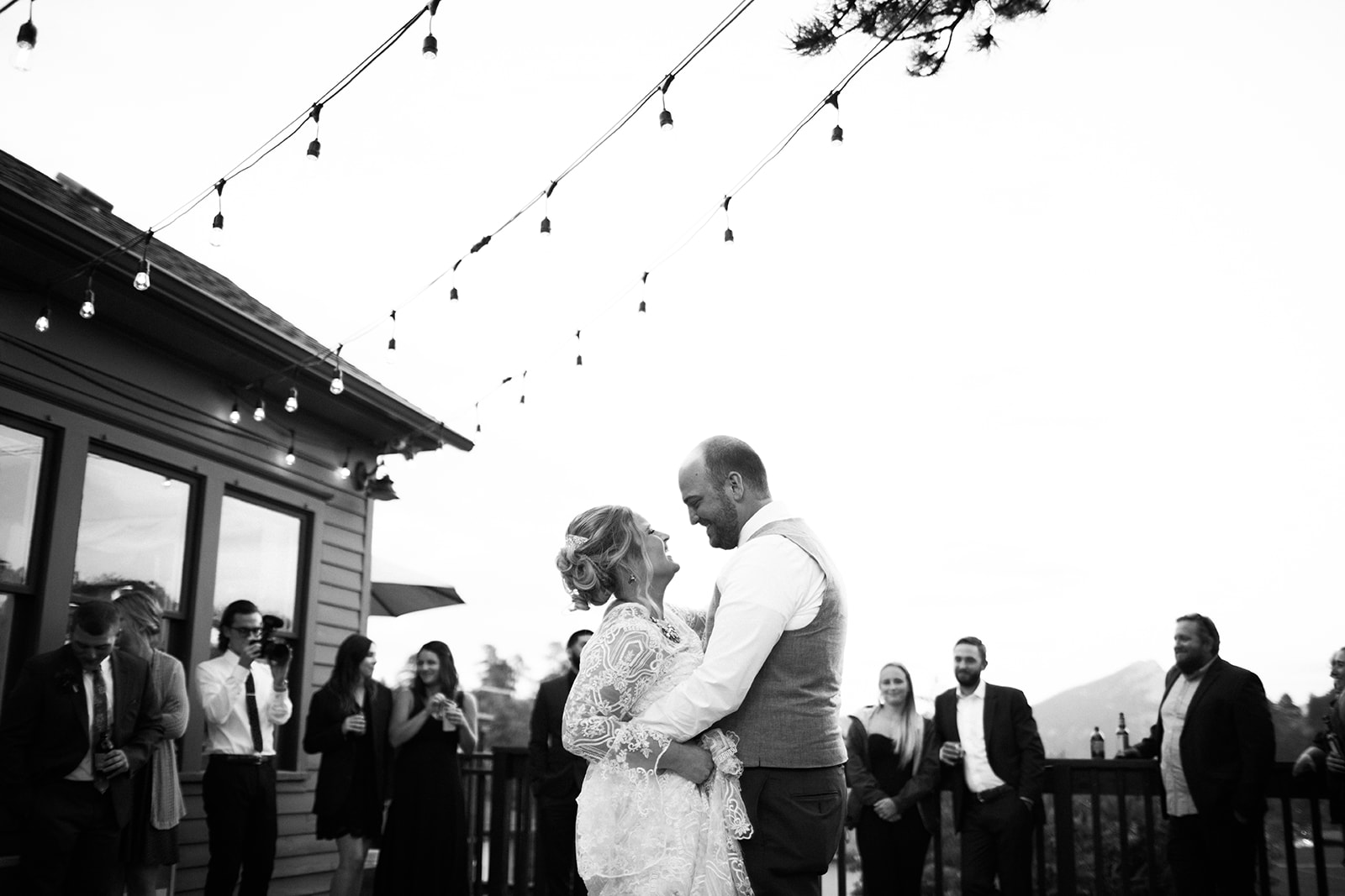 bride and groom first dance outdoor elopement ceremony with view of rocky mountains