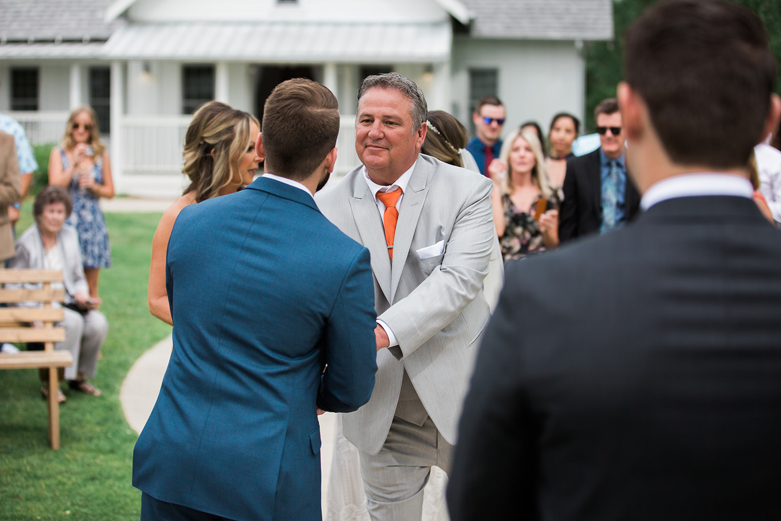 father of the bride shaking groom's hand
