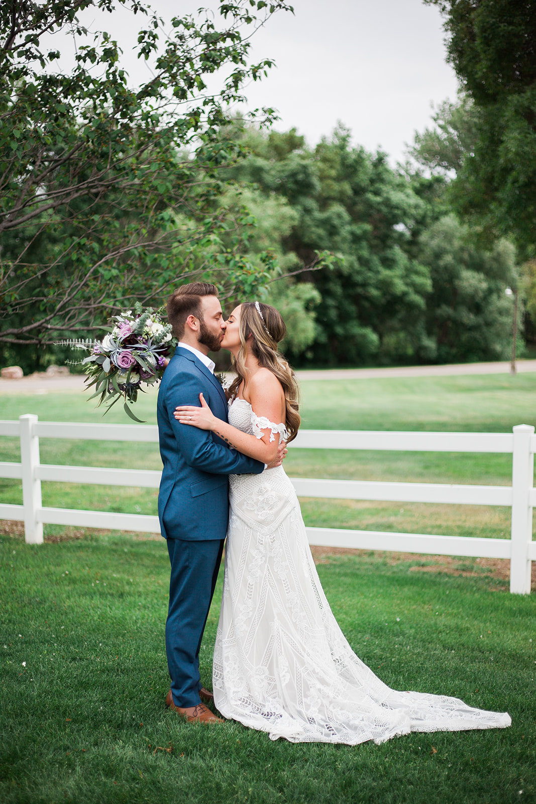 bride and groom kissing at raccoon creek wedding