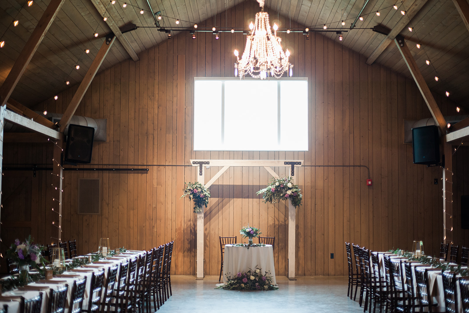 head table at wedding reception at Raccoon Creek barn