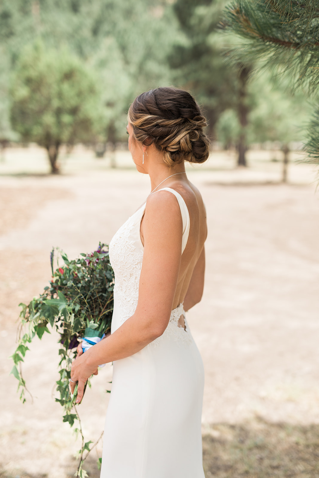 bride in dress and flowers for New Mexico winery wedding