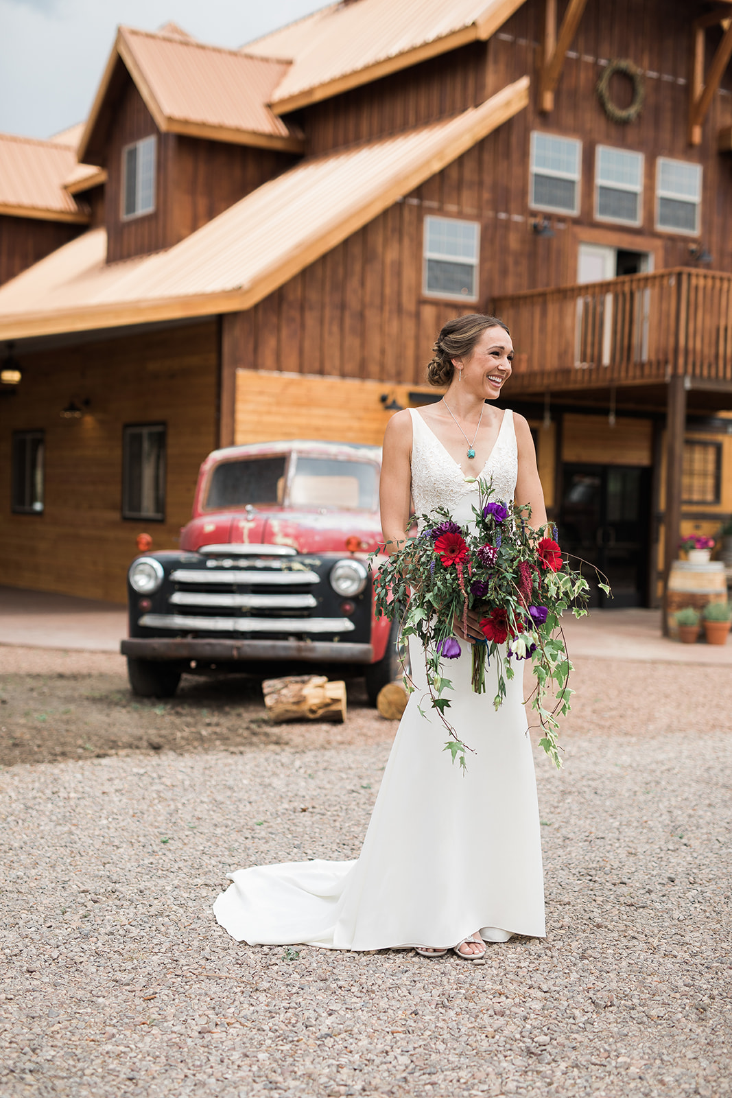 bride and bridesmaids with bouquets at barn in New Mexico wedding