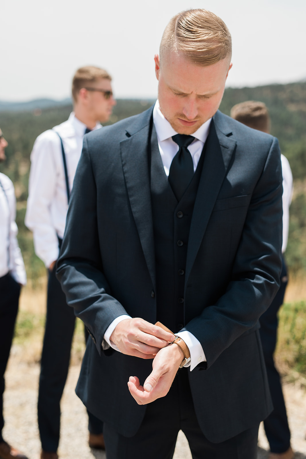 groom getting ready for enchanted winery wedding