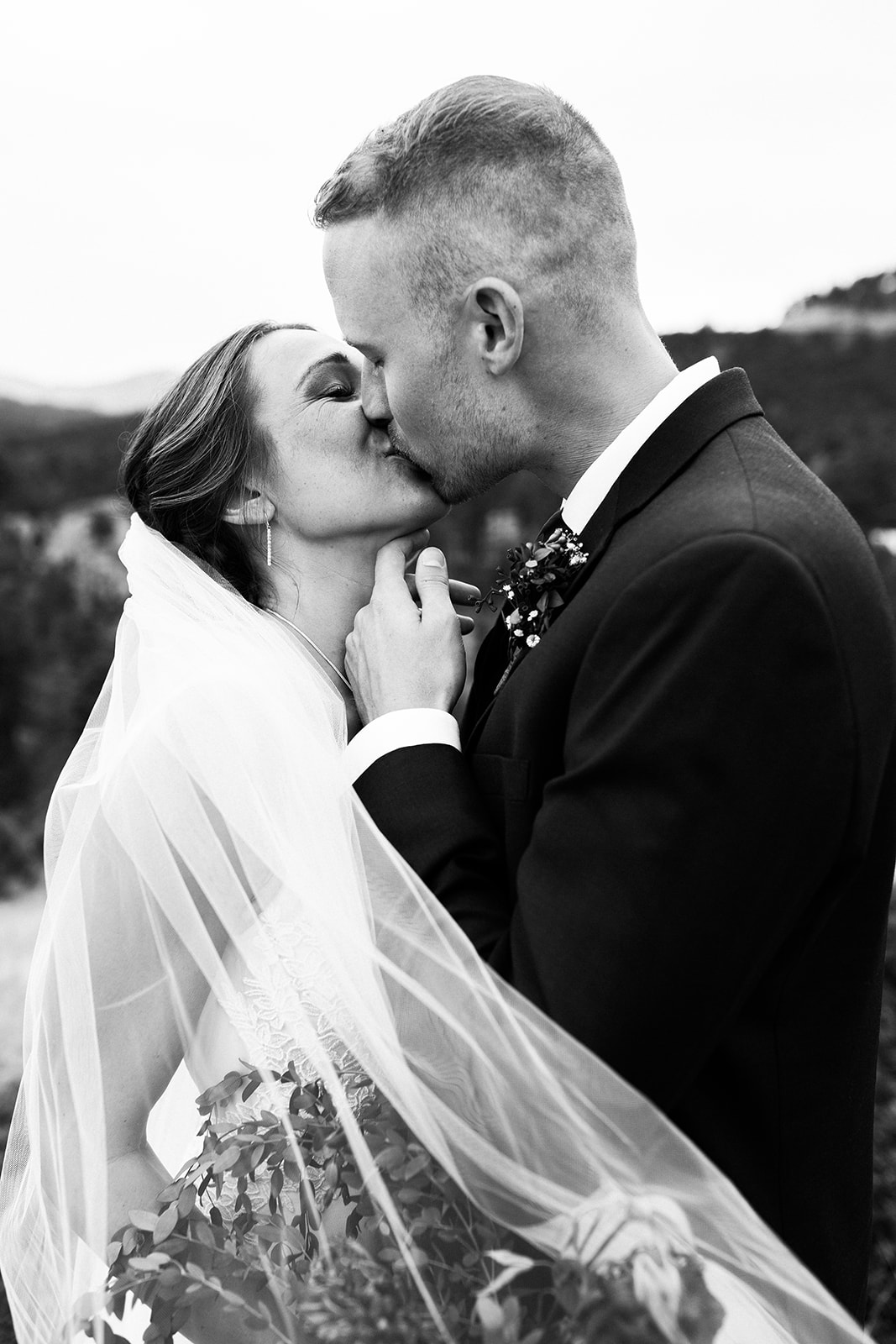 closeup of bride and groom kissing