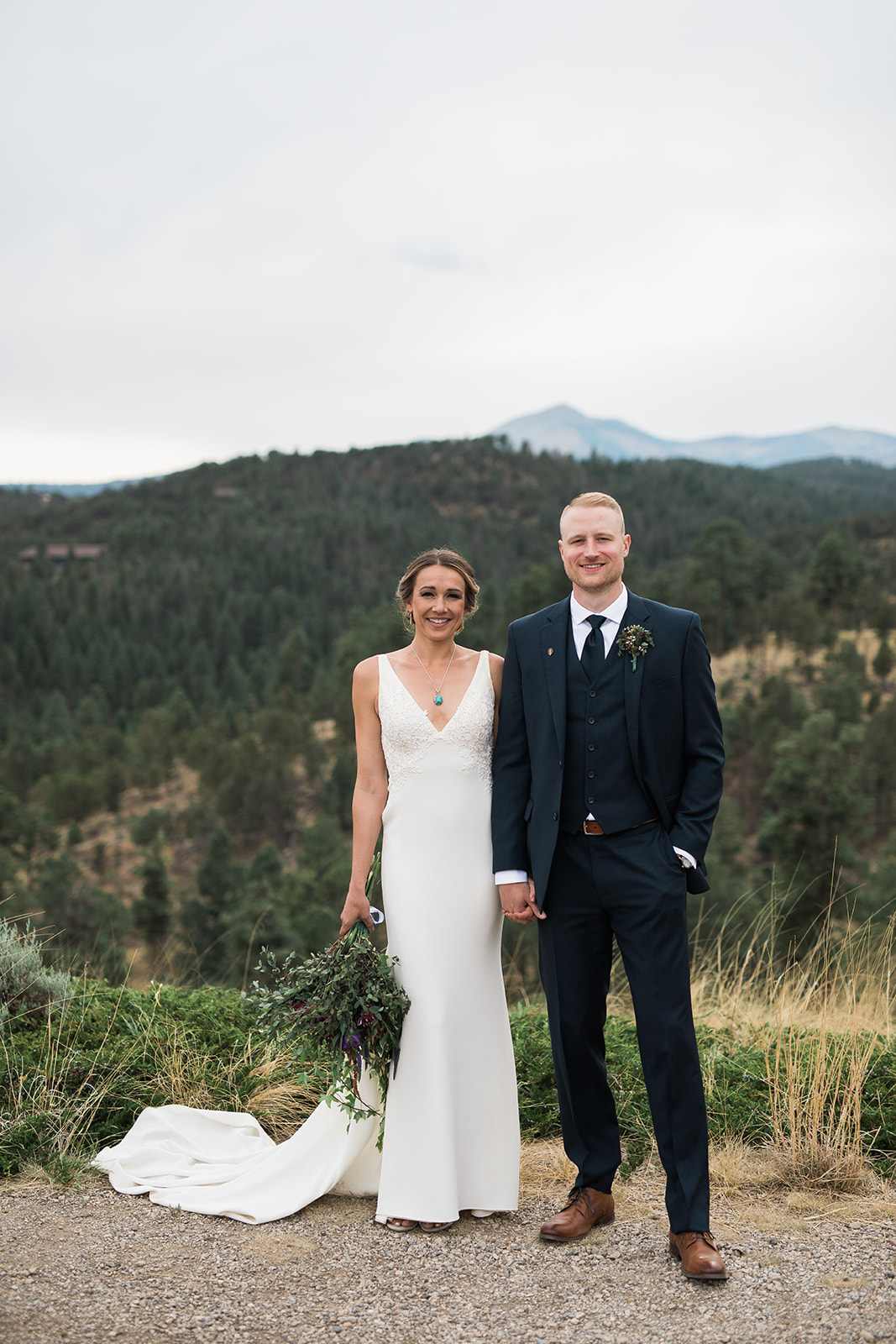 bride and groom with mountain backdrop at winery wedding
