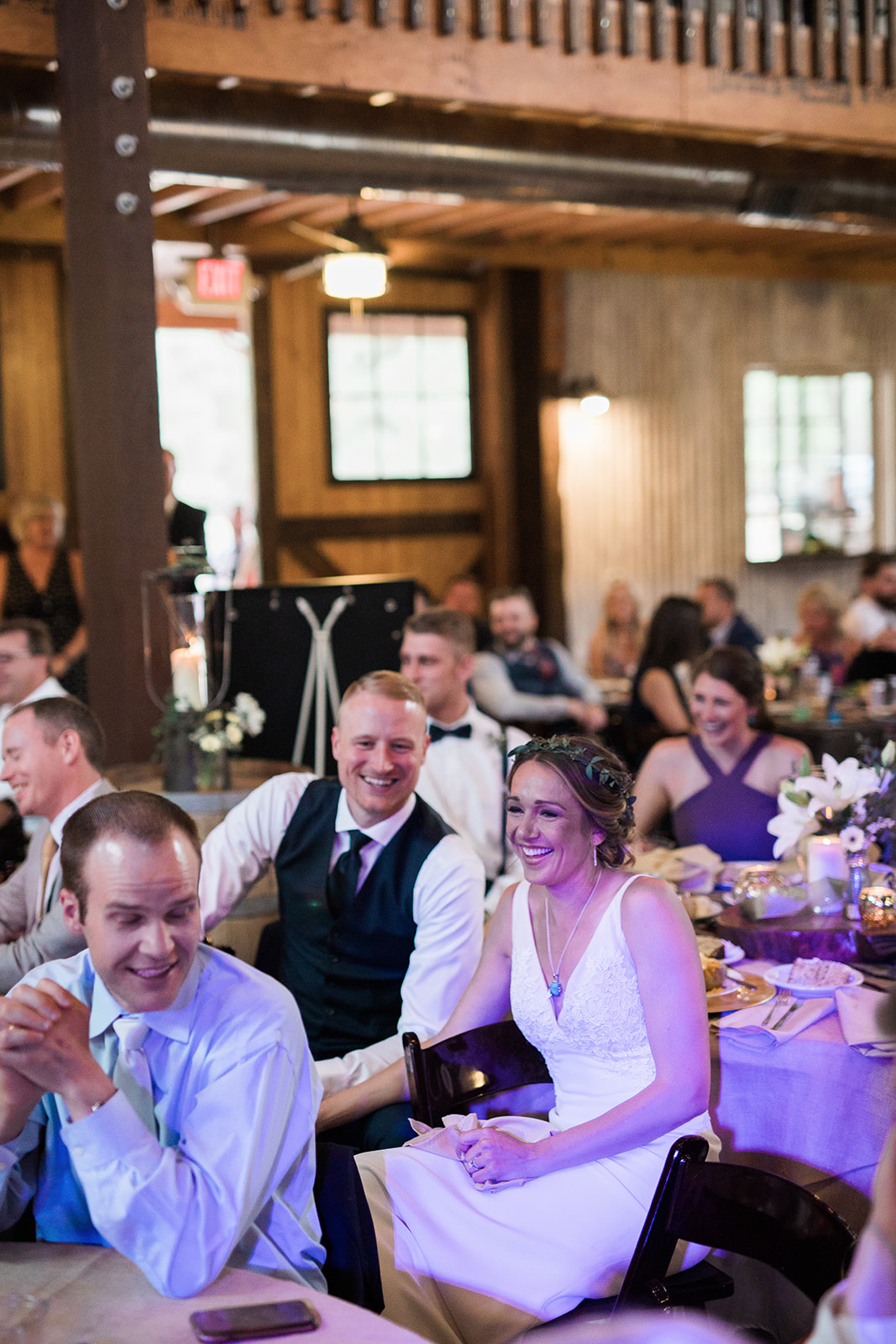bride and groom laughing after toast at New Mexico barn reception
