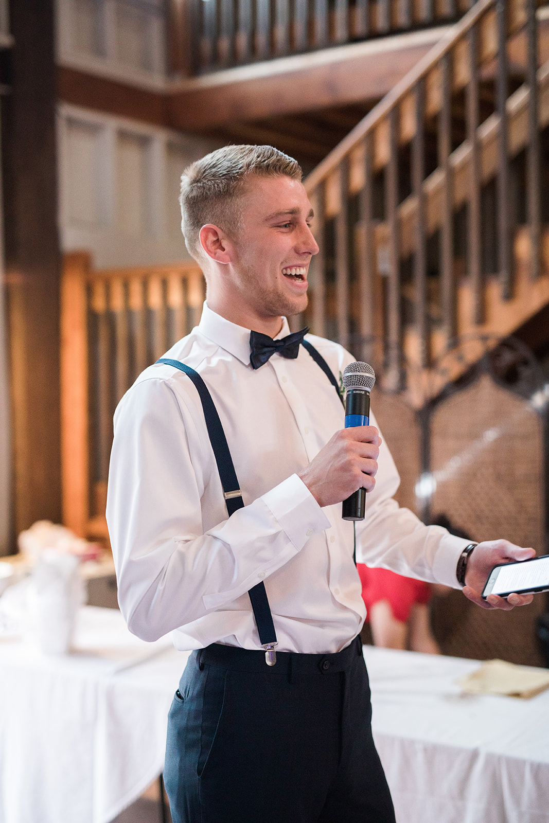 groomsman giving a toast at reception