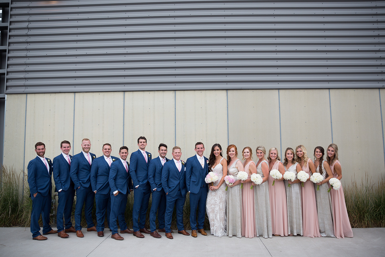 full bridal party outside space center in downtown denver