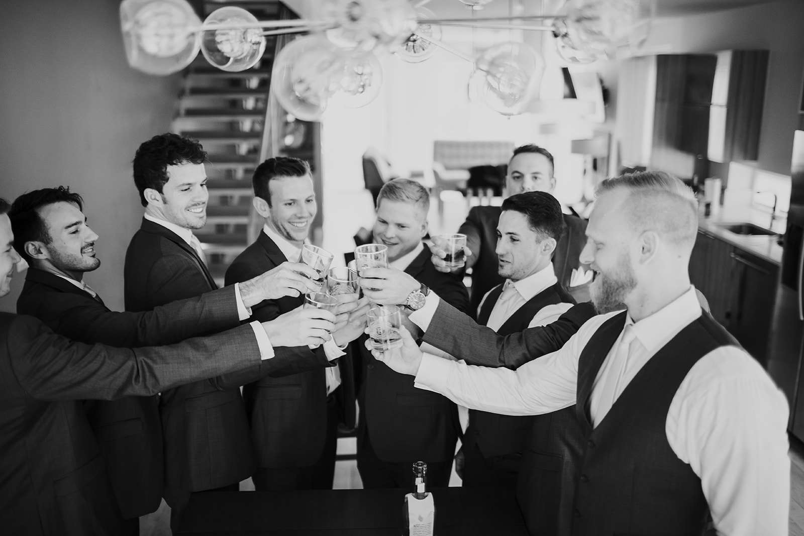 groom and groomsmen toasting at a Denver wedding