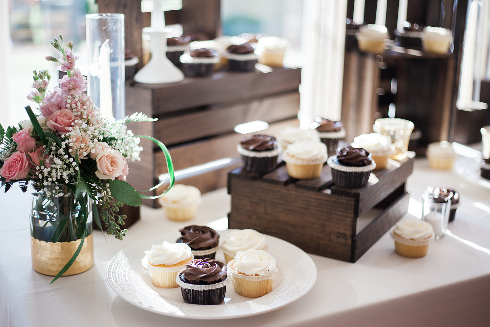 cupcakes on dessert table at reception