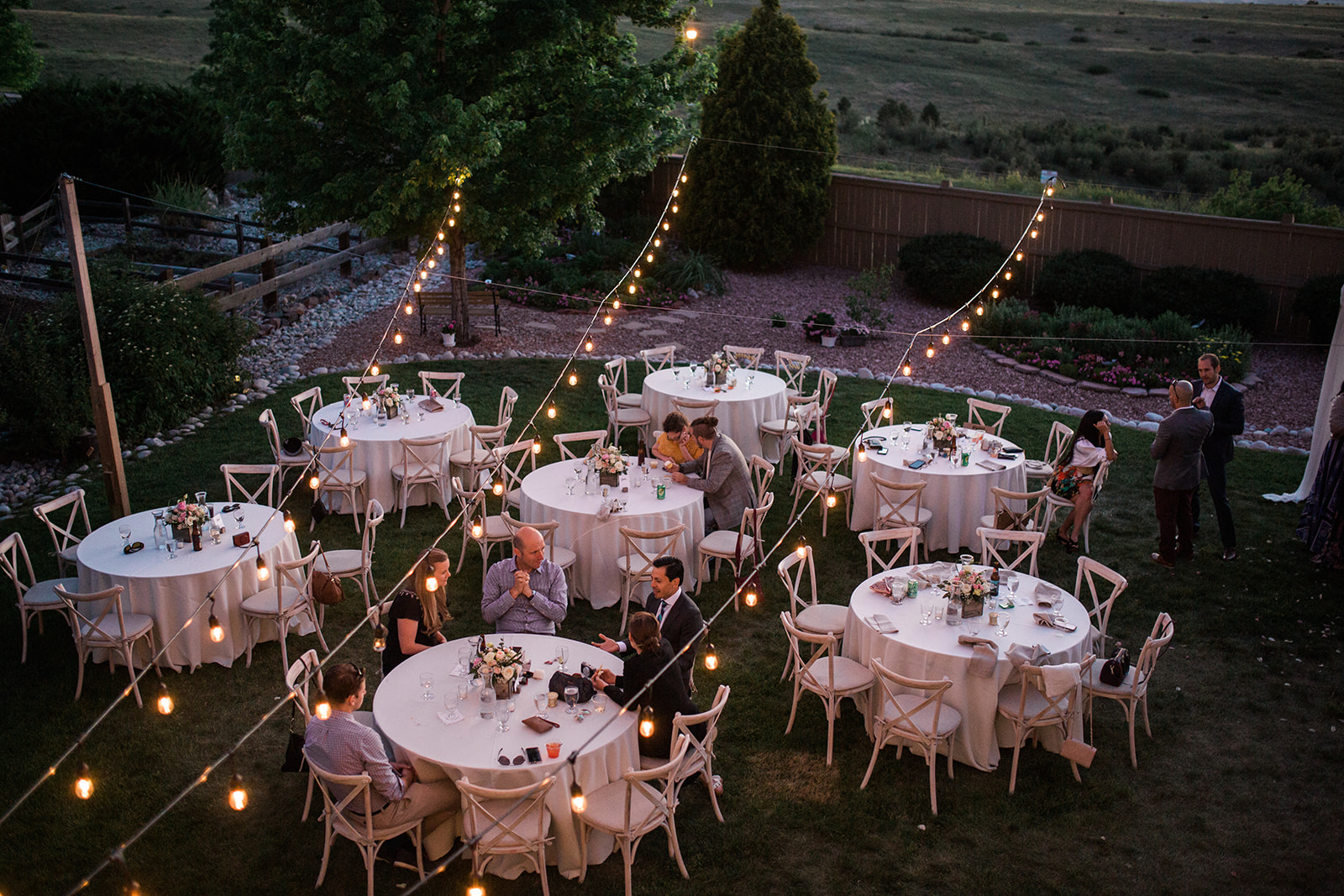 wedding reception at sunset in colorado backyard wedding