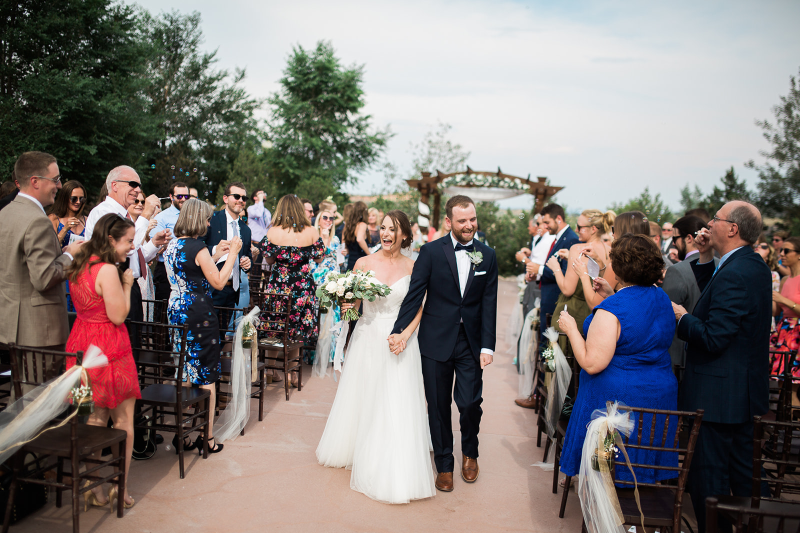 bride and groom walk back down aisle at Willow Ridge Manor