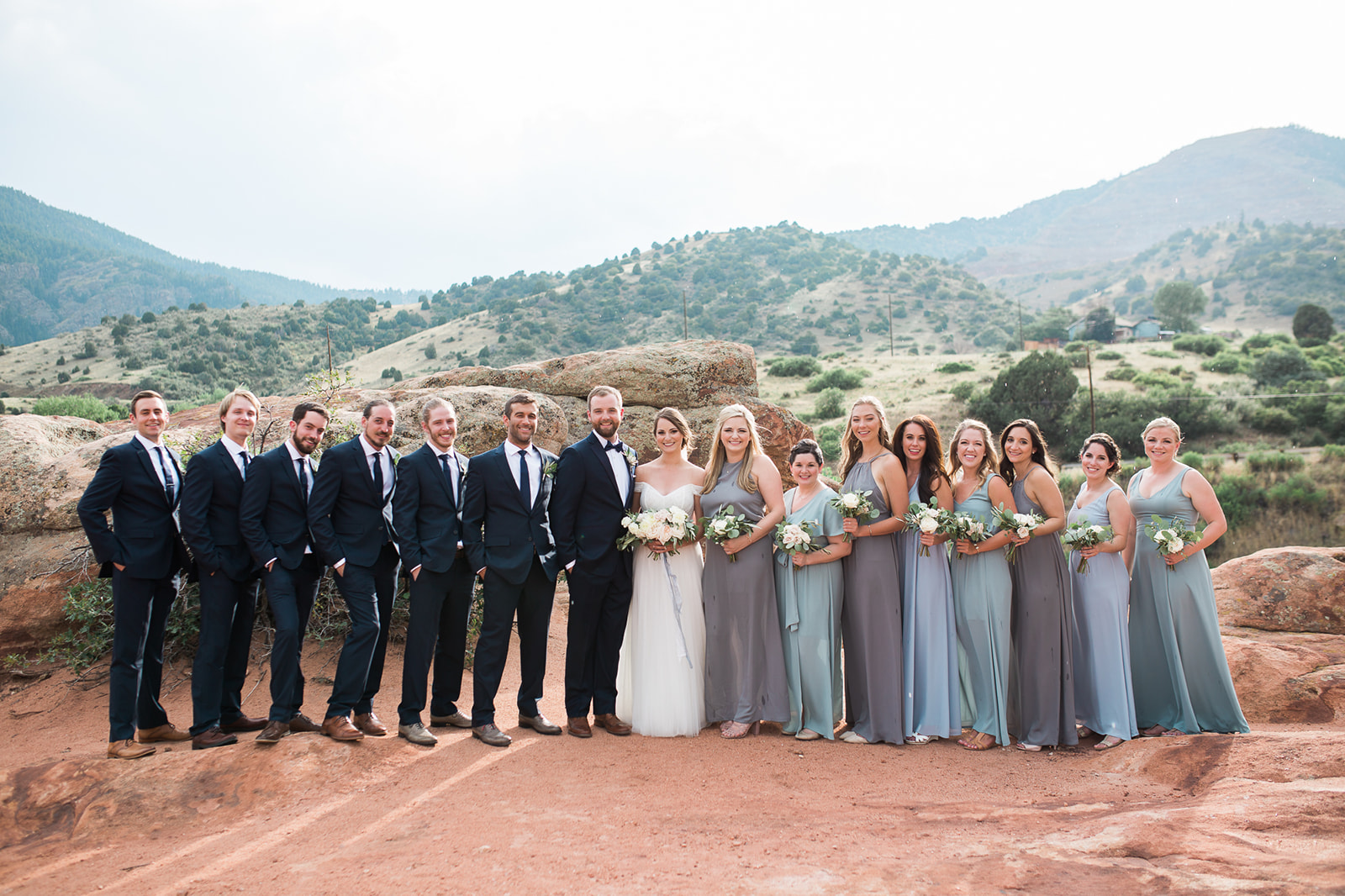 bridesmaids and groomsmen with colorado mountain backdrop in Morrison Colorado