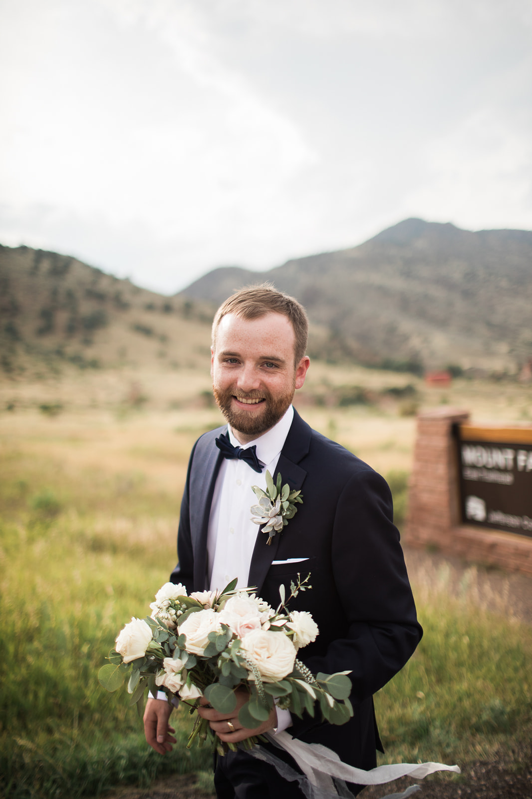 groom ready for portraits in Morrison Colorado
