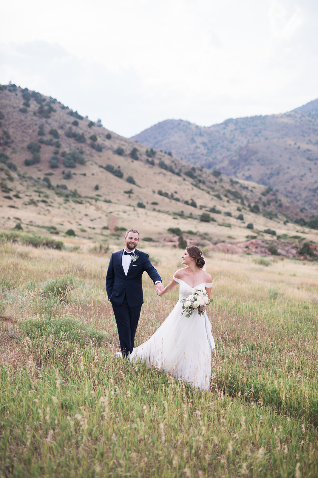 groom and bride outside Willow Ridge Manor in Morrison Colorado