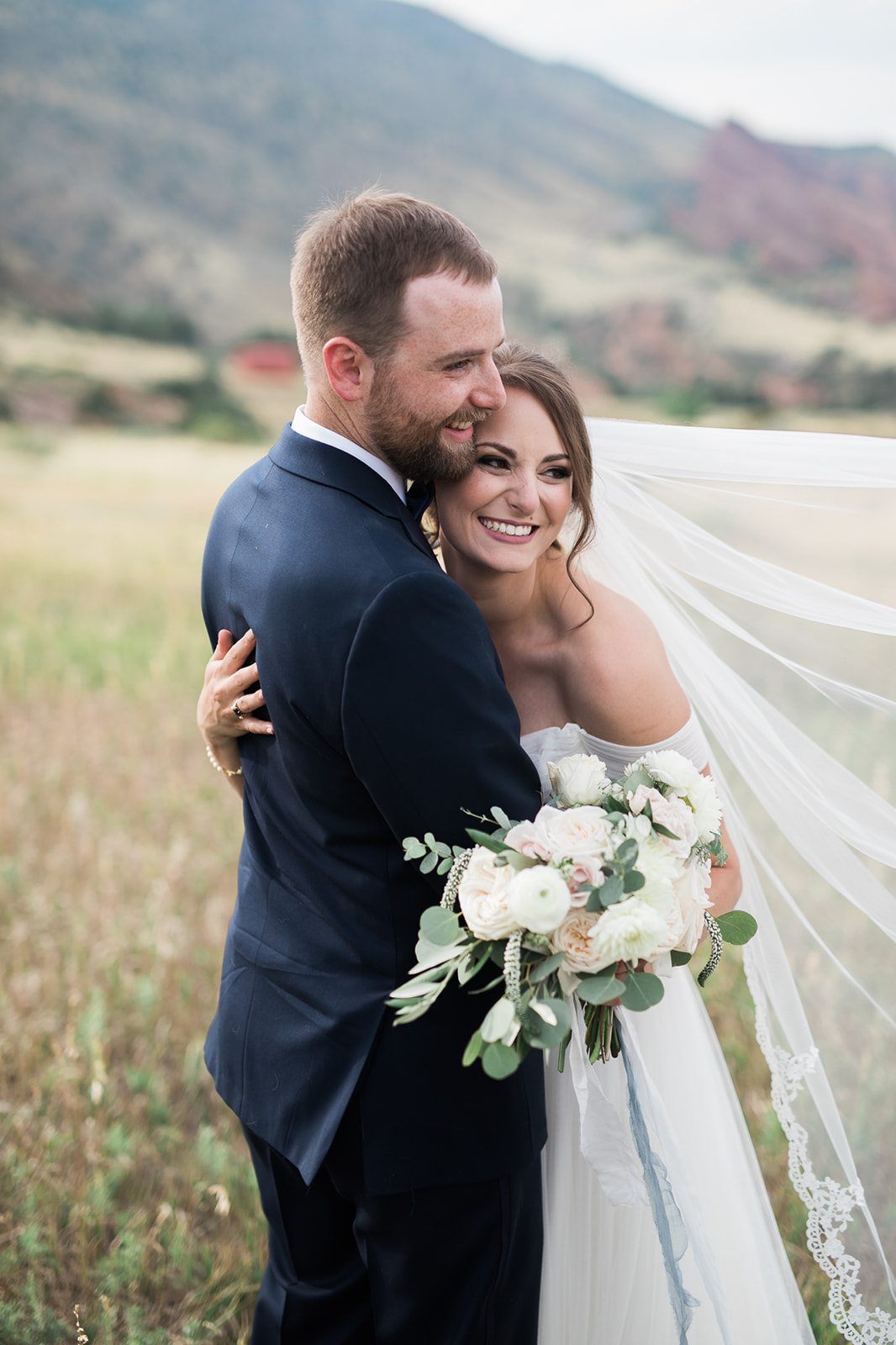 groom and bride outside Willow Ridge Manor in Morrison Colorado