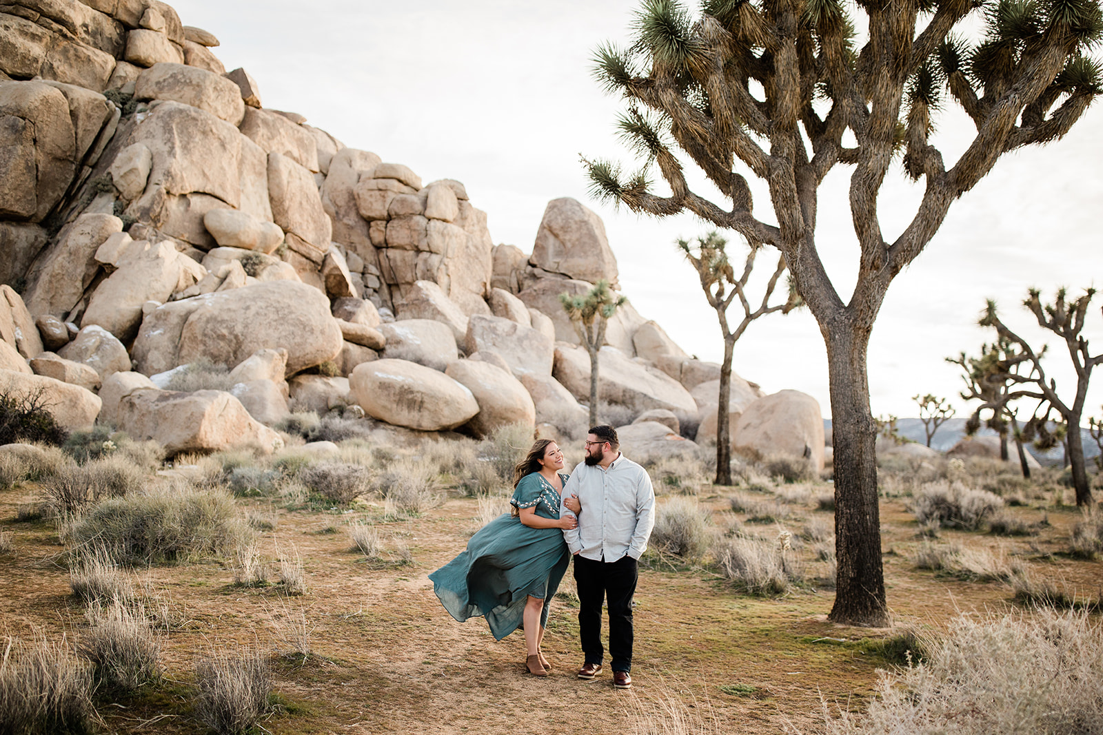 couple in front of gorgeous Joshua Tree park vista