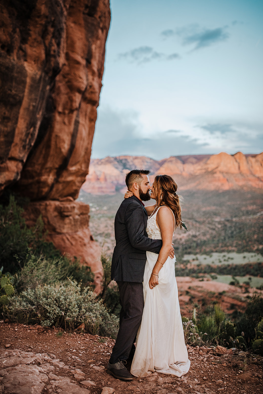 bride and groom kiss after desert elopement