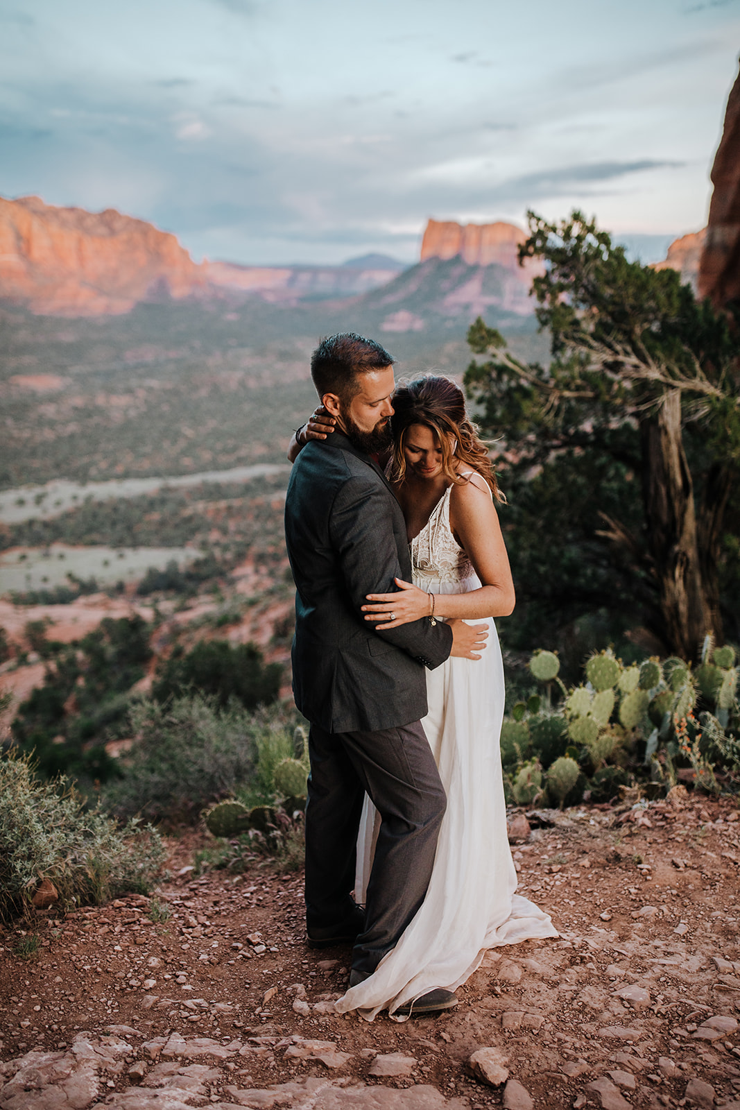 bride and groom kiss after desert elopement
