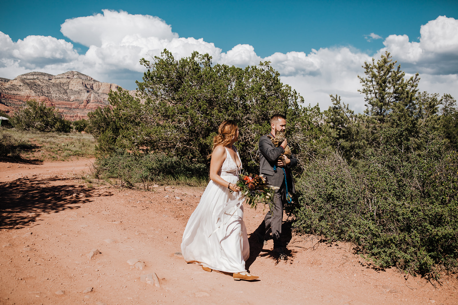 bride and groom with adventure cat for Sedona desert elopement