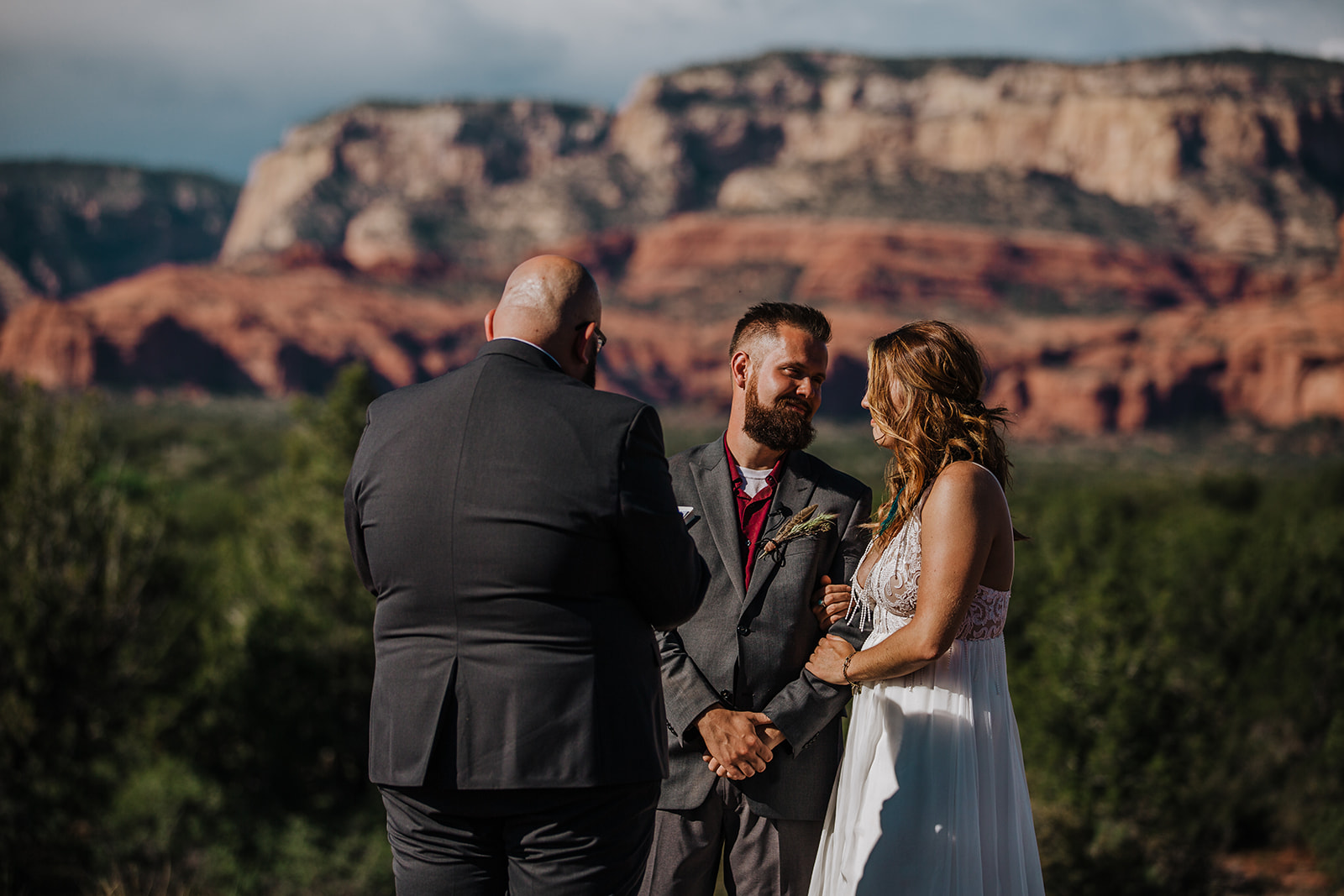bride and groom look at each other at end of elopement ceremony in Sedona Arizona
