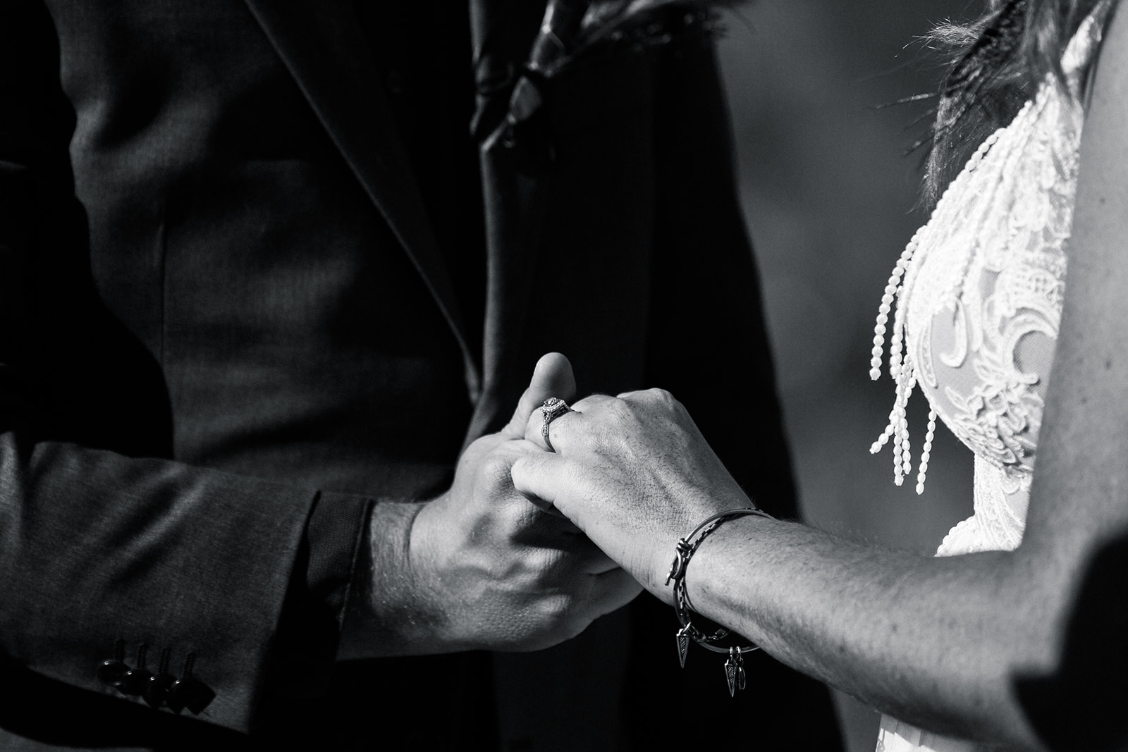 bride and groom exchange rings in elopement ceremony in Sedona Arizona