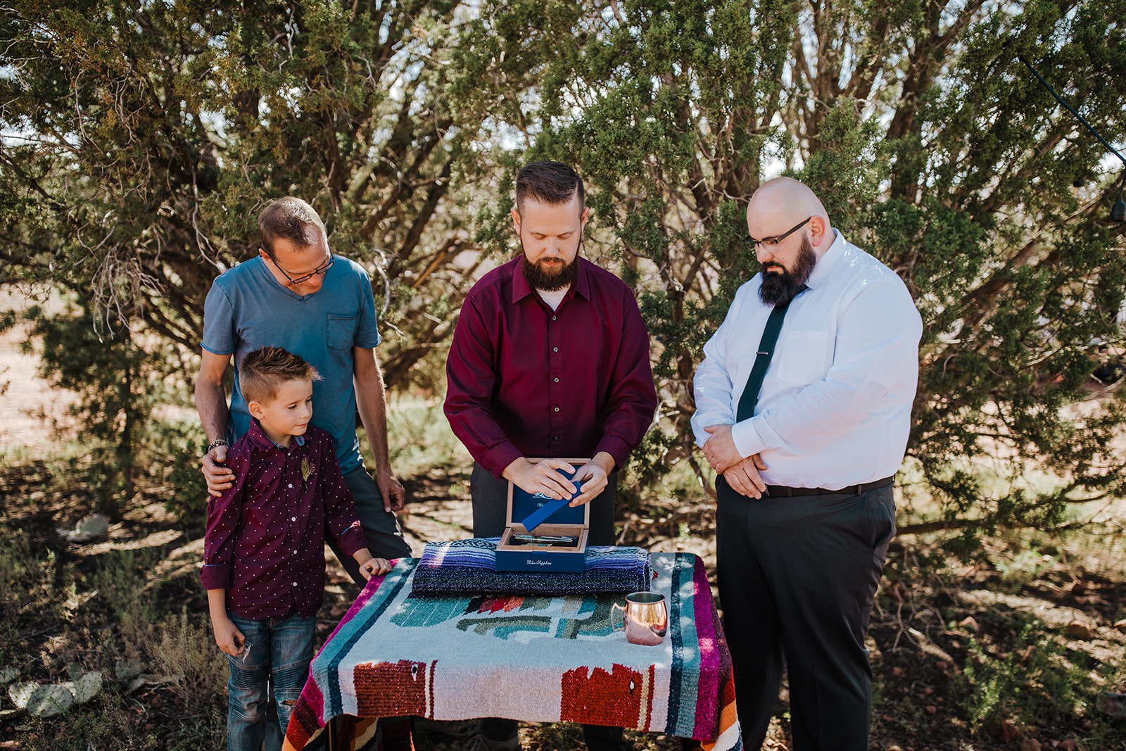 groom sharing gifts with attendants of small Arizona elopement