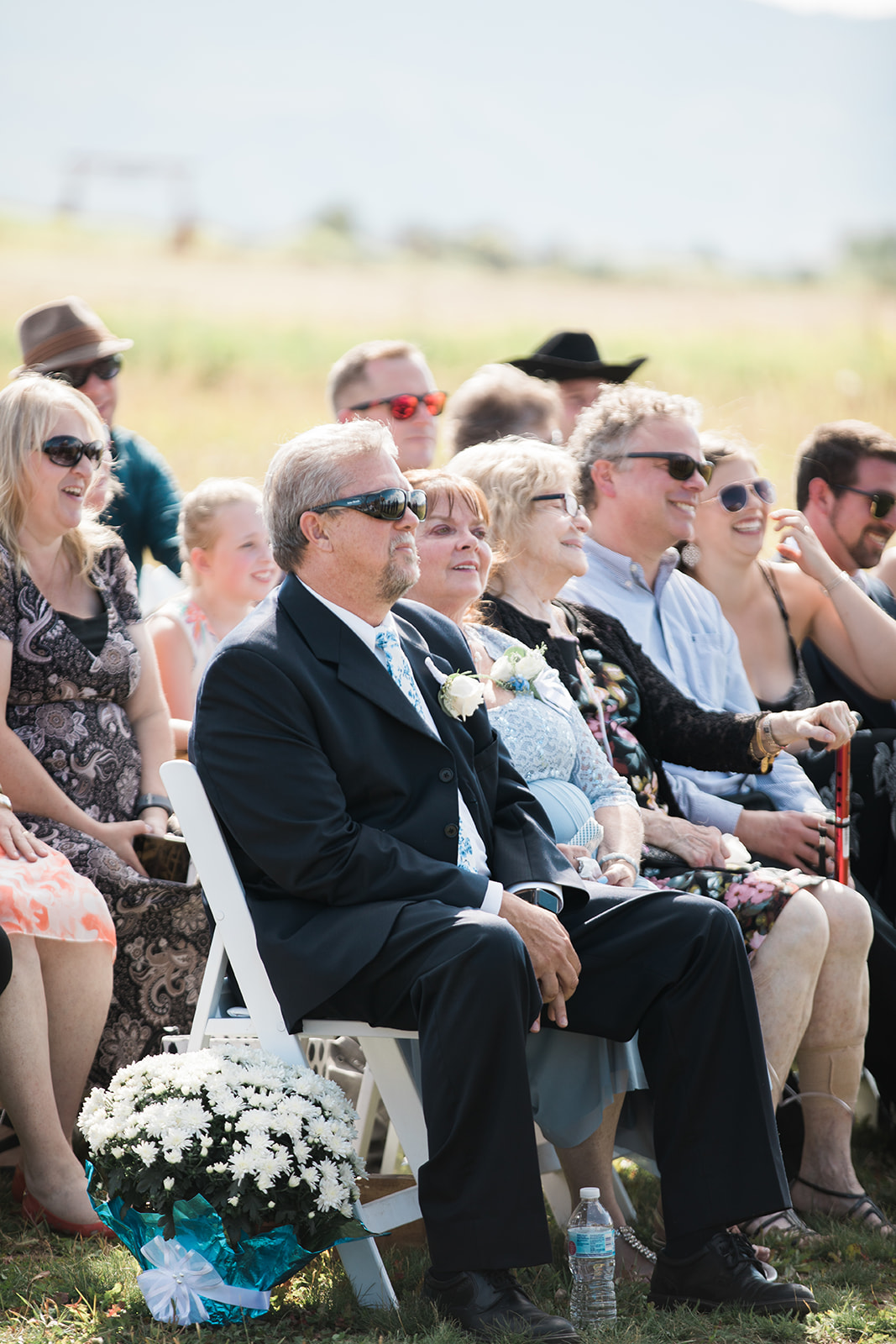 parents watching wedding ceremony at Crestview Ranch Lodge