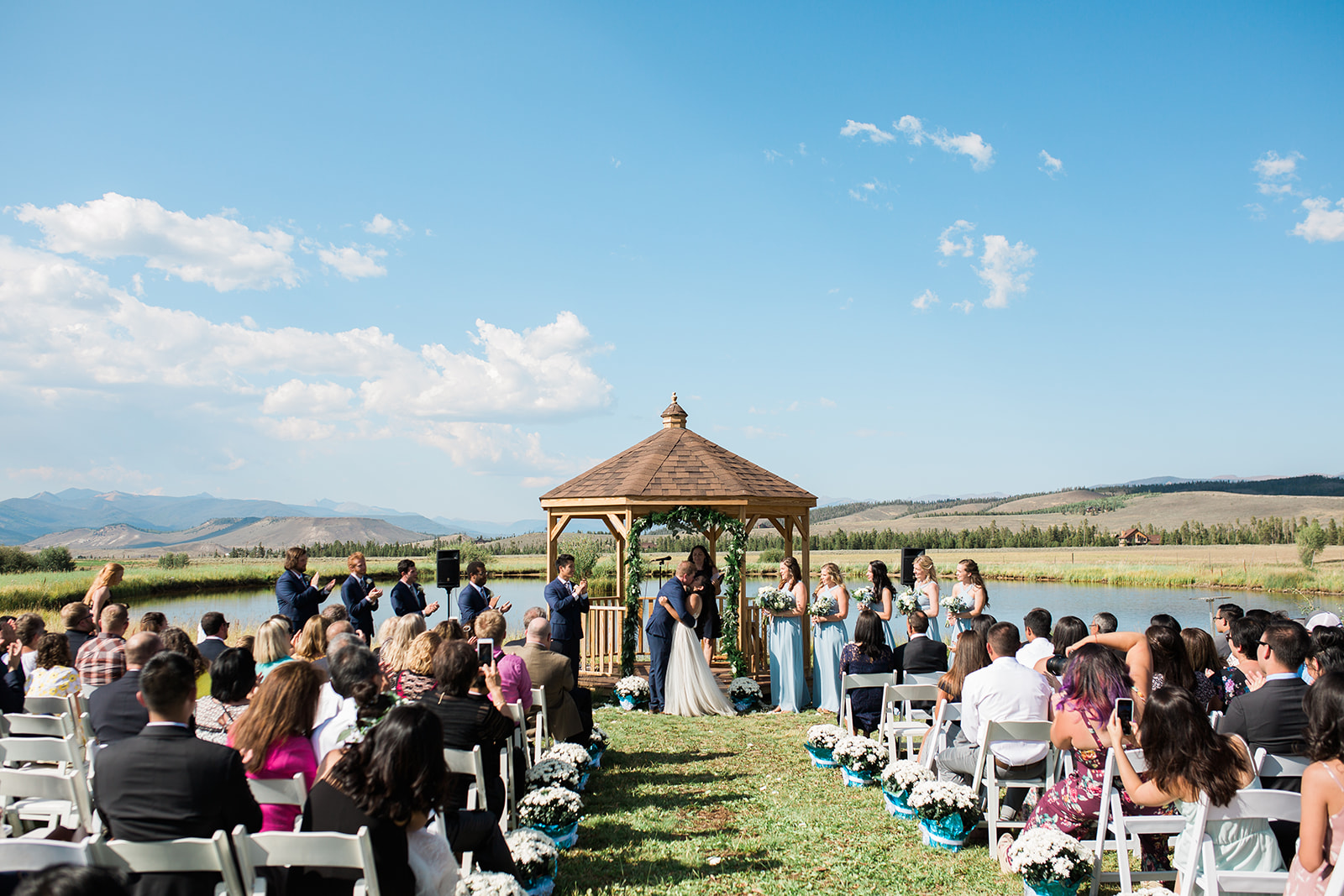 first kiss after outdoor mountain ranch wedding