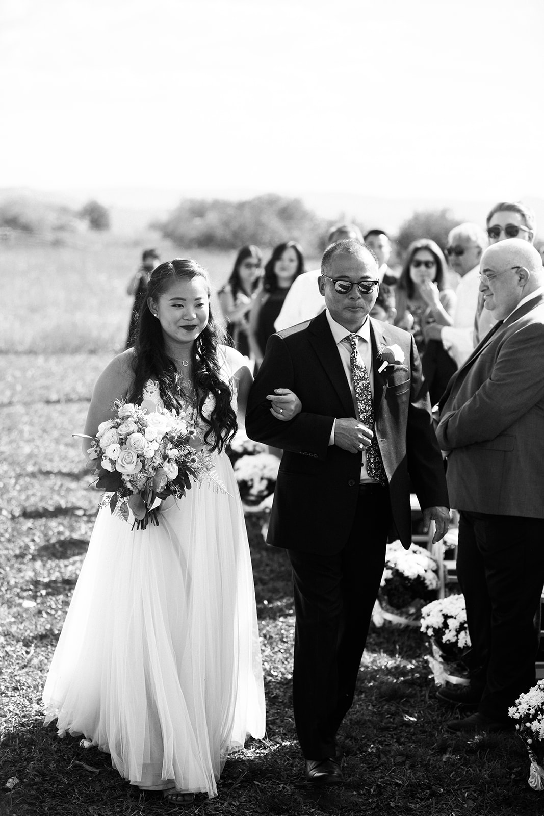 bride and father walk down the aisle at Crestview Ranch wedding