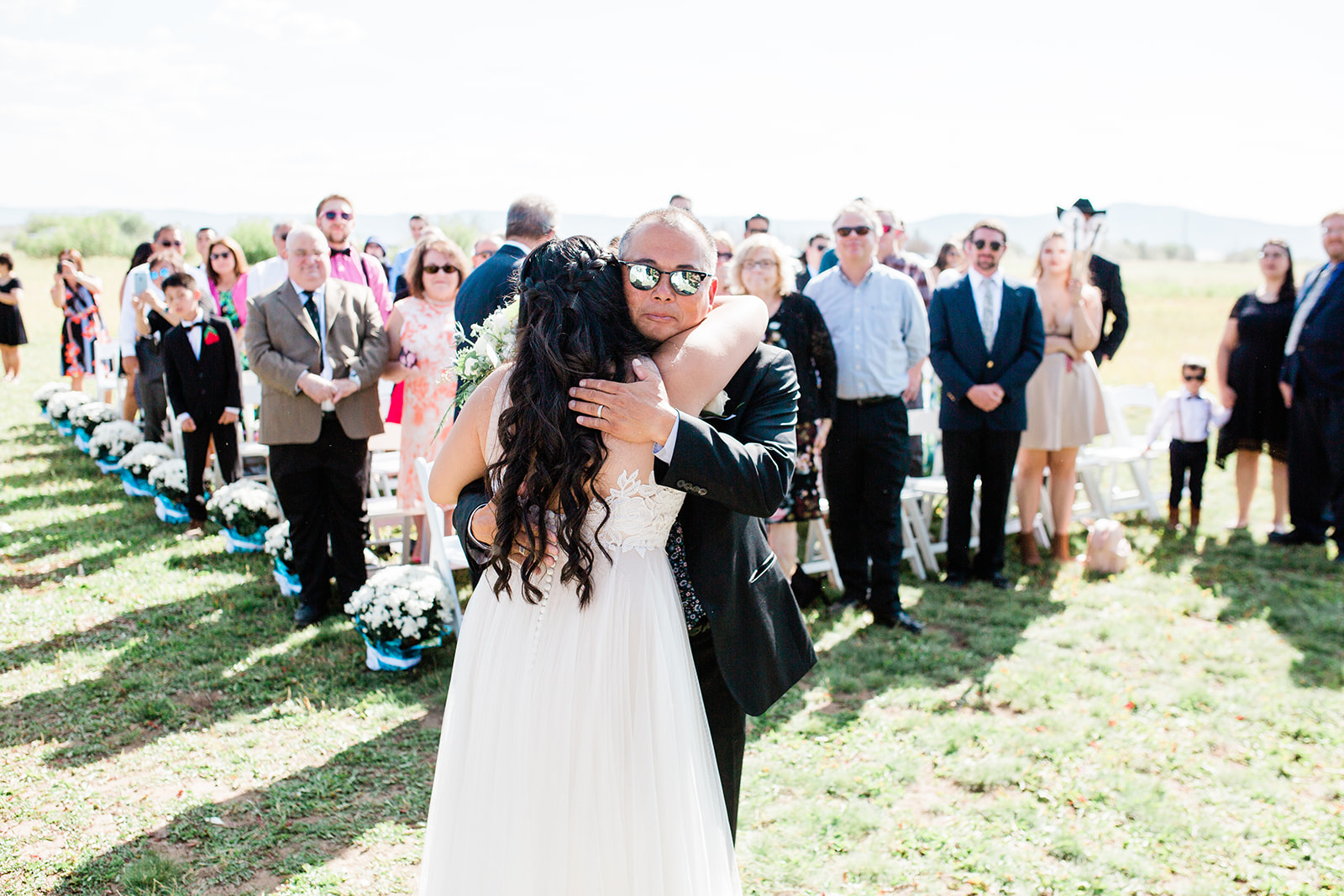 bride and father walk down the aisle at Crestview Ranch wedding