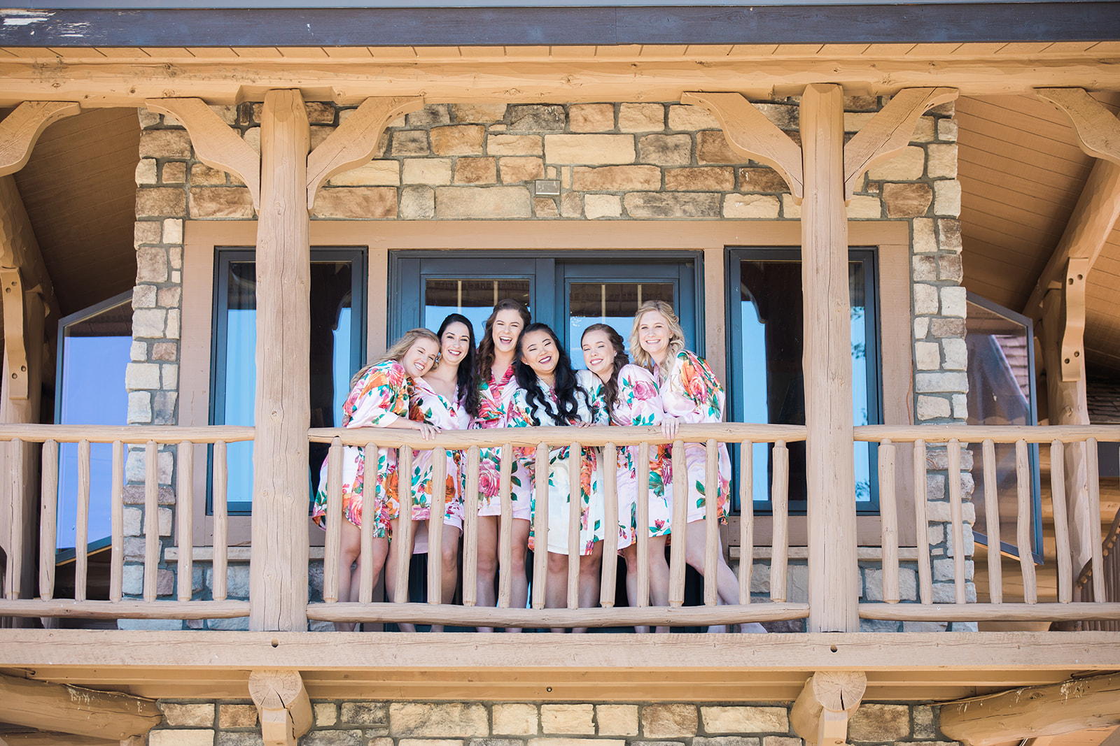 bride and bridesmaids in colorful robes in Crestview Ranch