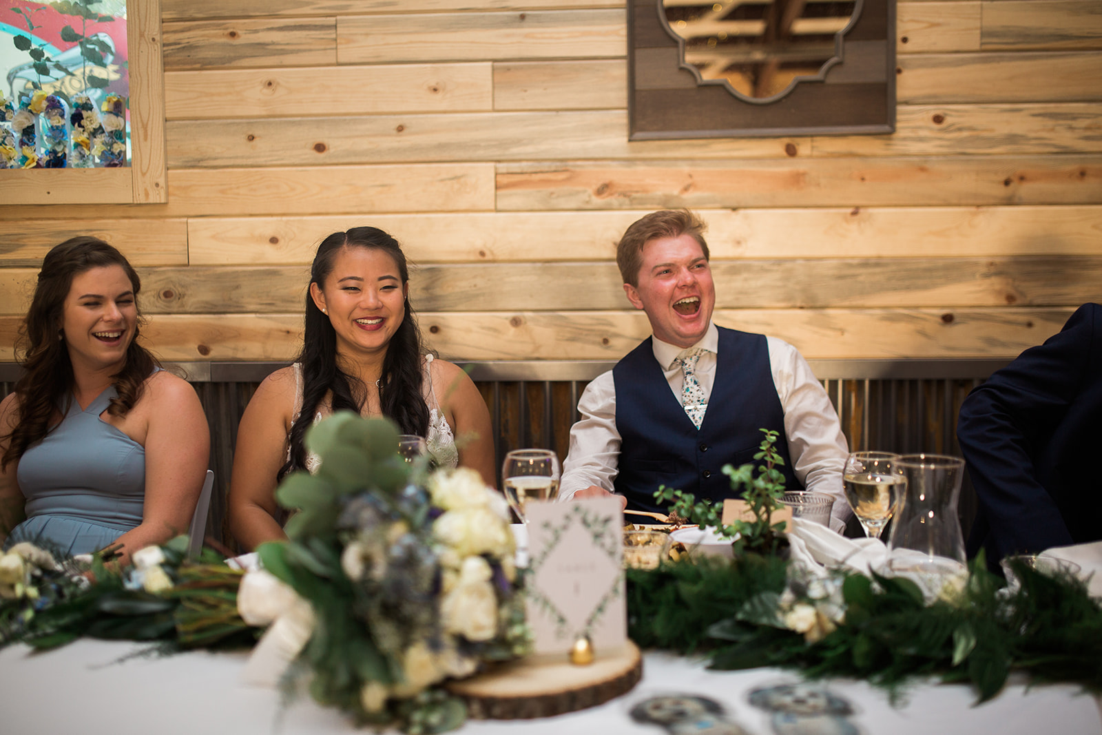 bride and groom toasts at Crestview Ranch Lodge wedding reception