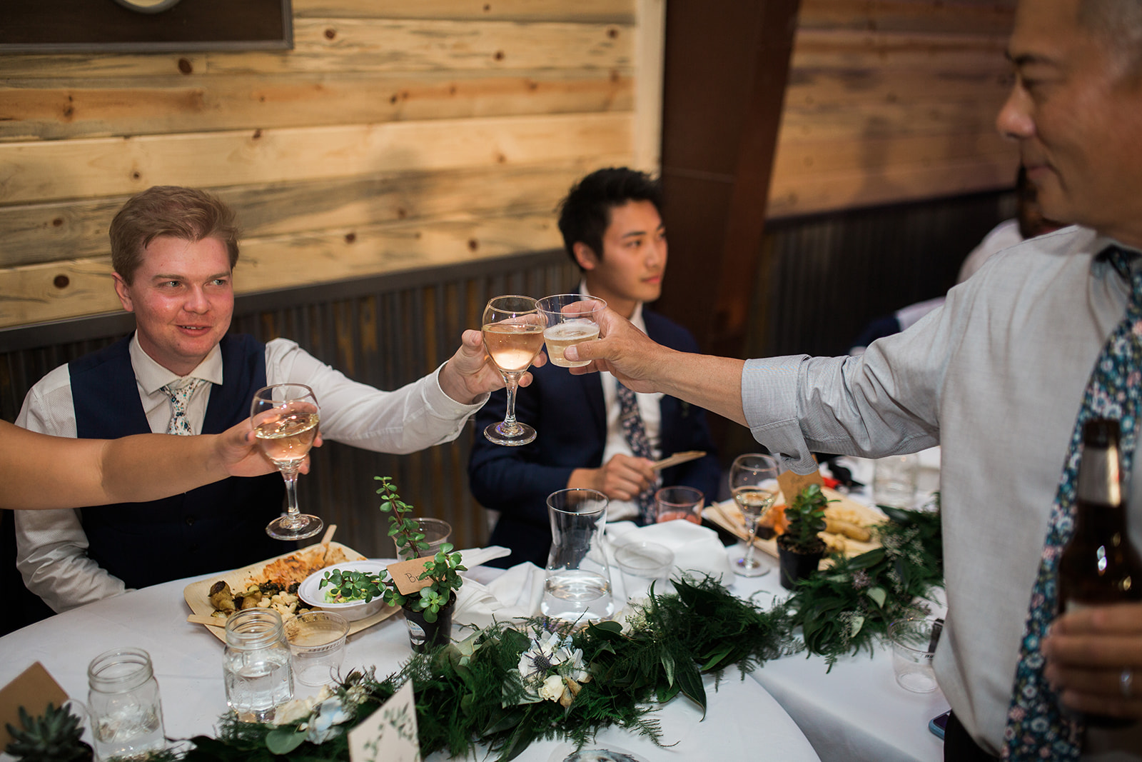 bride and groom toasts at Crestview Ranch Lodge wedding reception