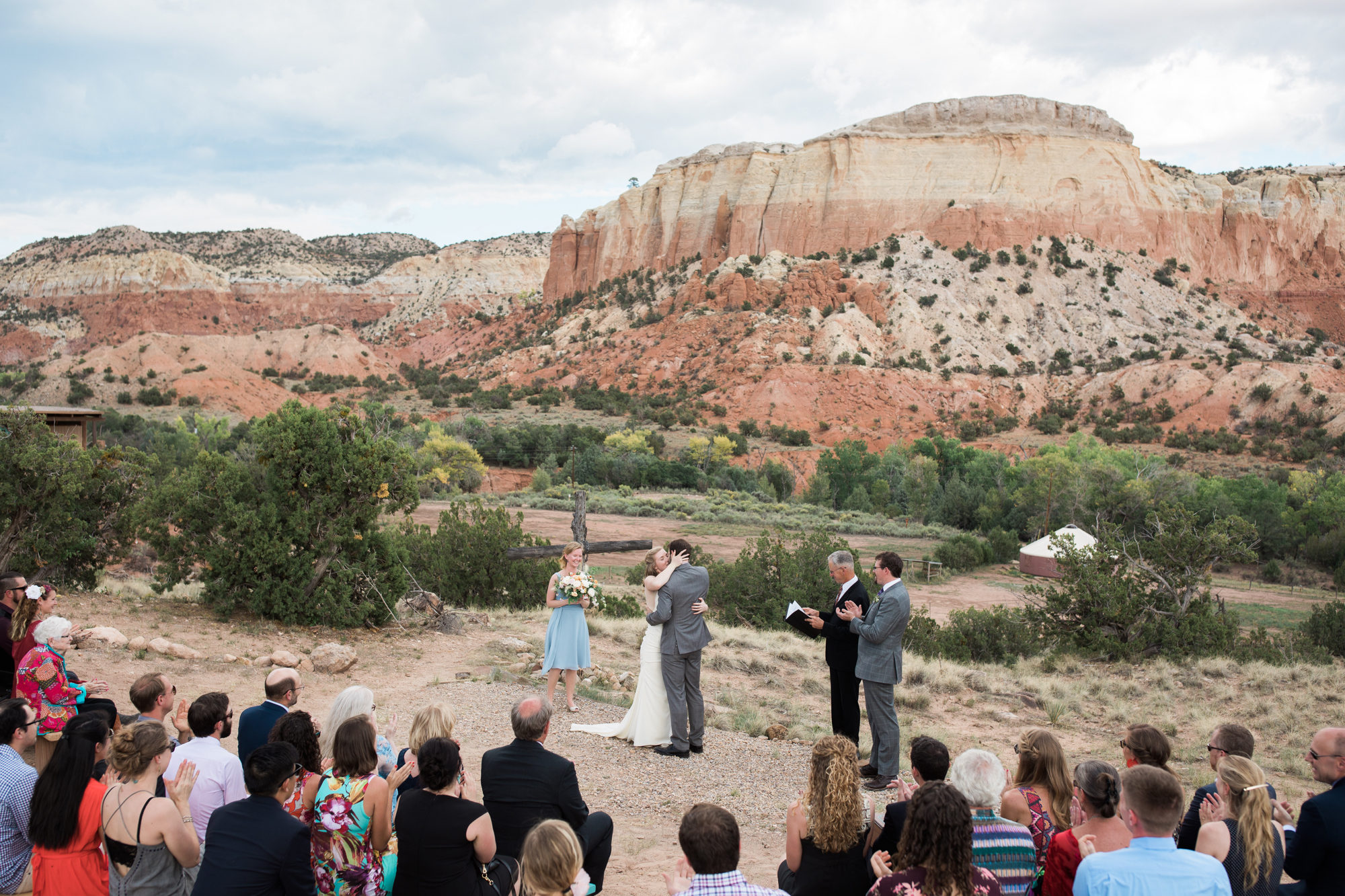 bride and groom first kiss at Ghost Ranch wedding