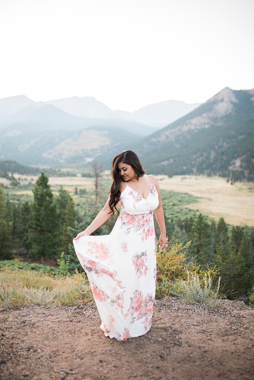 woman in flowered dress in Rocky Mountains